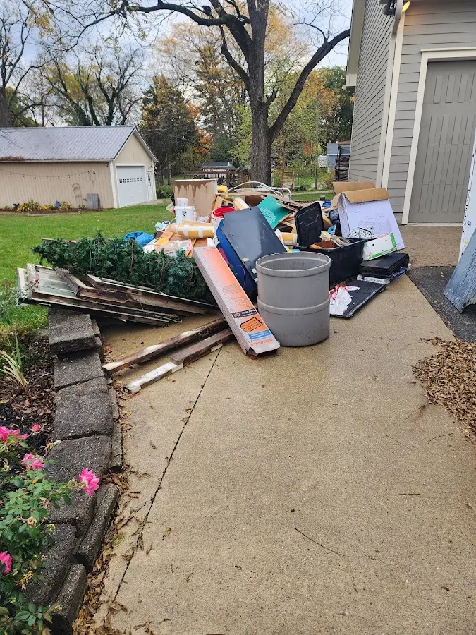 Dumpster being loaded with debris for Commercial Dumpster Rental in Spring Valley Lake